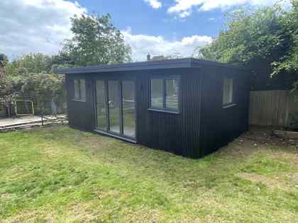 Kymarn Construction garden room extension with black timber cladding